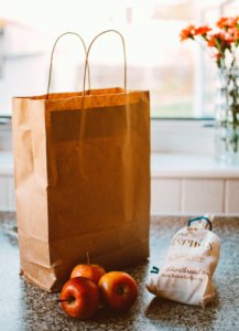 Several Apples Beside Bread Pack And Brown Paper Bag 1992912