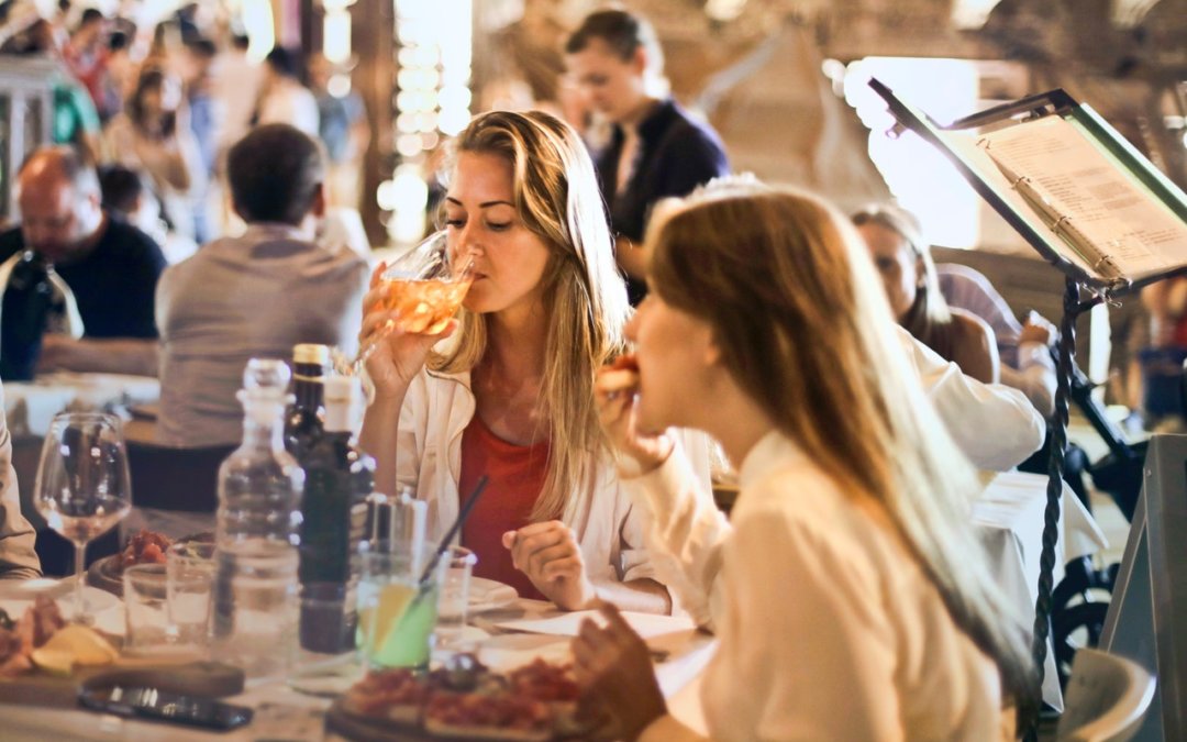 people enjoying their meals at a restaurant